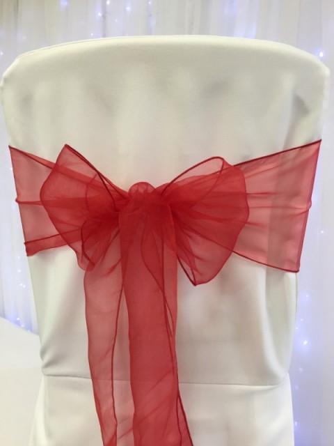 Bright red organza. Hire price £1. Replacement value £3 each