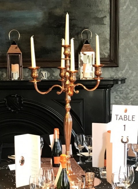 Copper five arm candelabra. Can be dressed with artificial flowers
