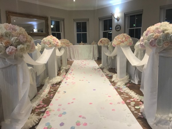 Another aisle set up using brides floral toppers