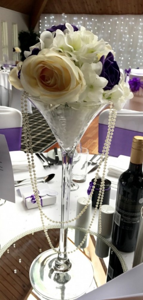 Martini vase with flowers and hanging pearls