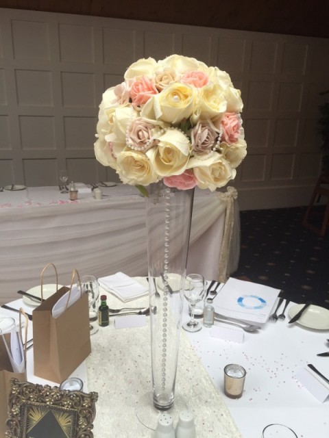 Pastel coloured rose ball with hanging pearl chain