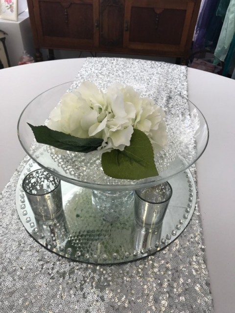 Glass footed bowl with white artificial floral head